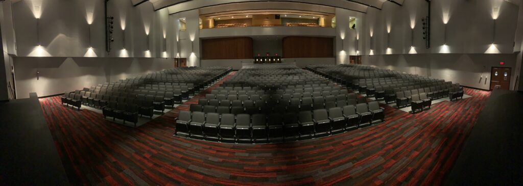 Wide view of school auditorium seating