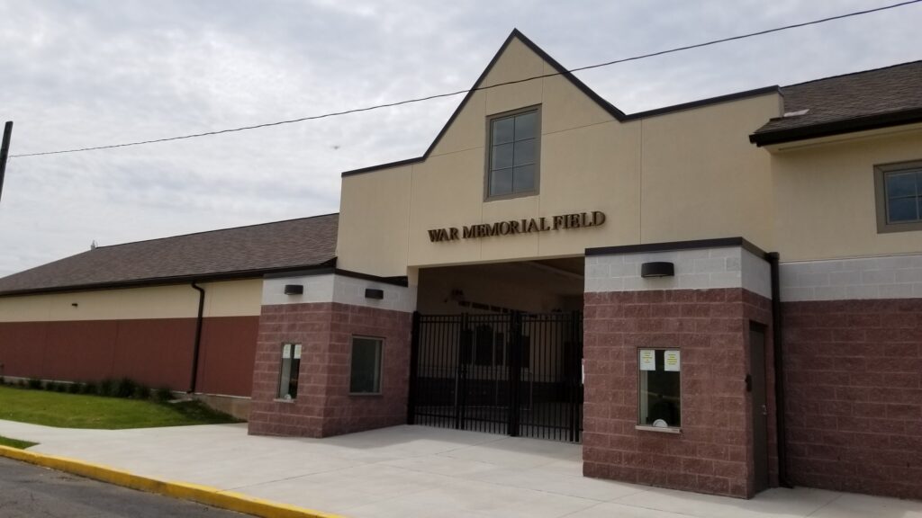 Brick entrance building at a school memorial field