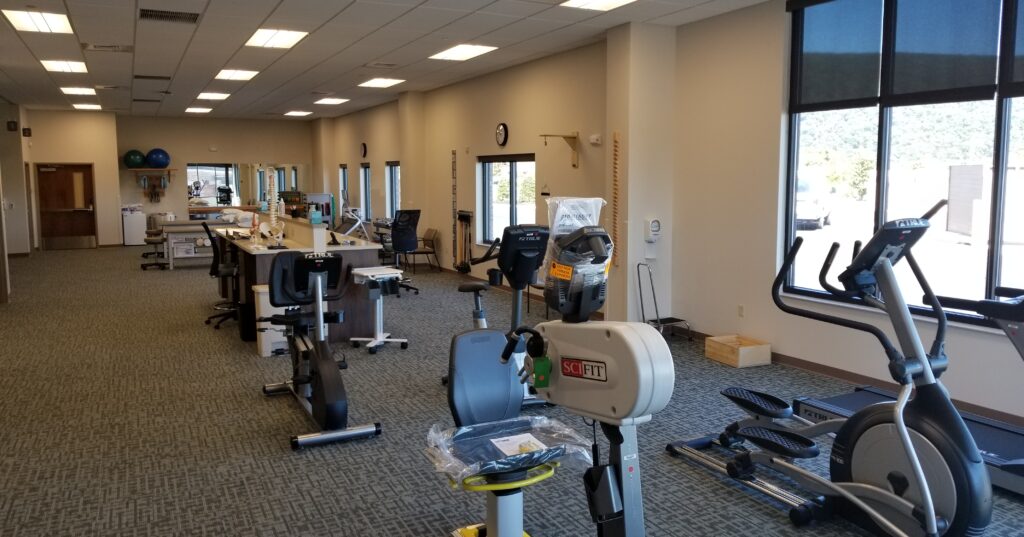 Physical therapy gym with exercise equipment