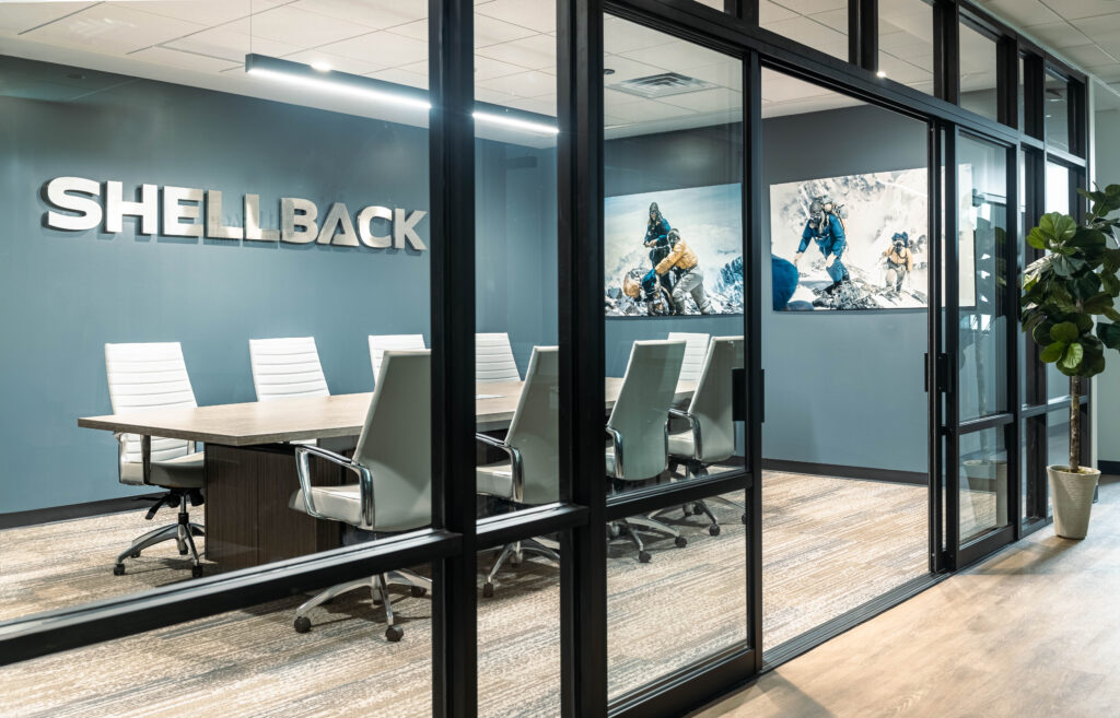 Glass-walled conference room in a renovated office
