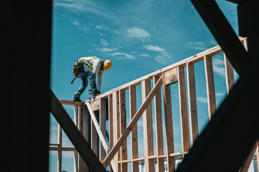 Carpenter framing a wood wall